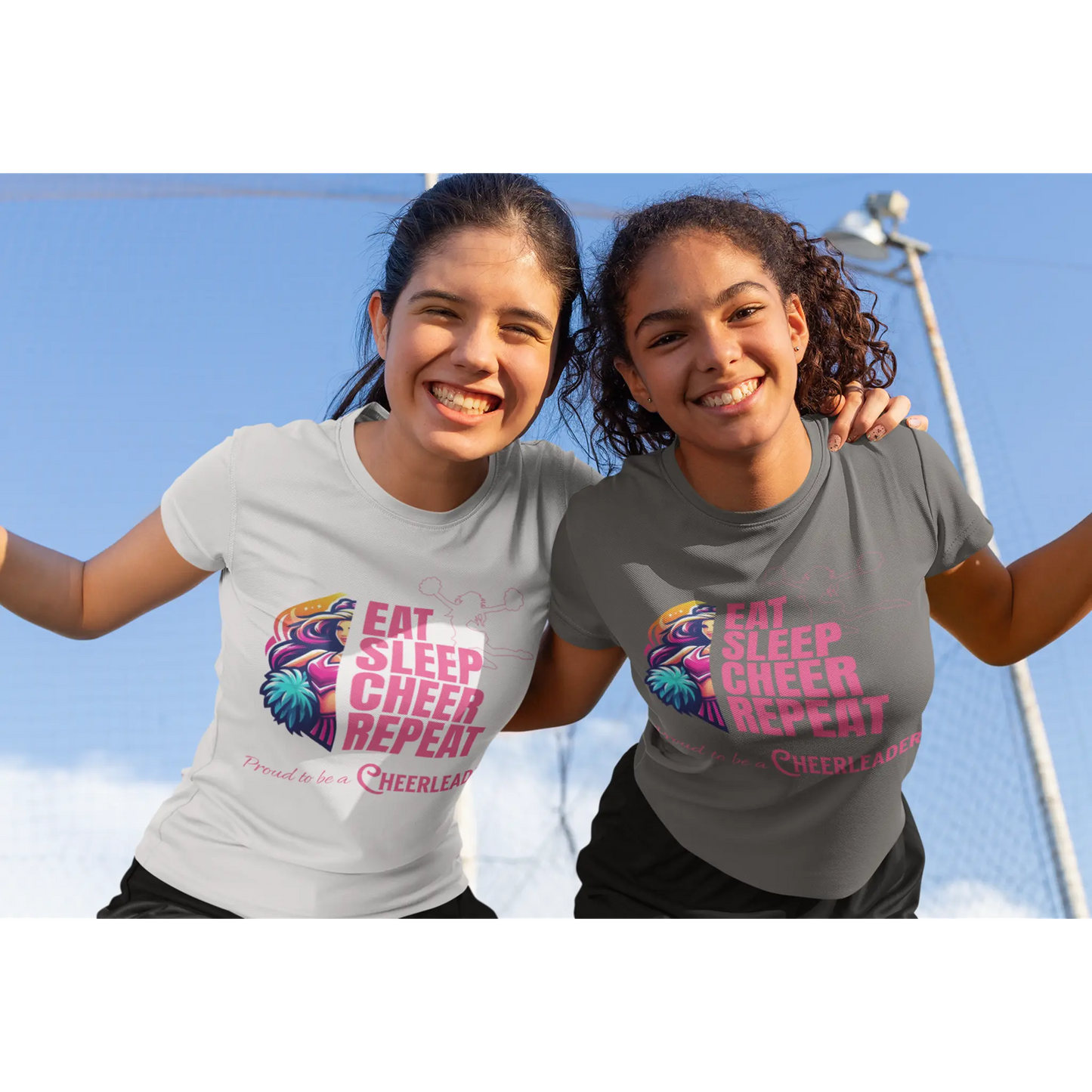 Cheerleader wearing grey t-shirt and another cheerleader in a white t-shirt both with 'Eat Sleep Cheer Repeat' cheerleading design
