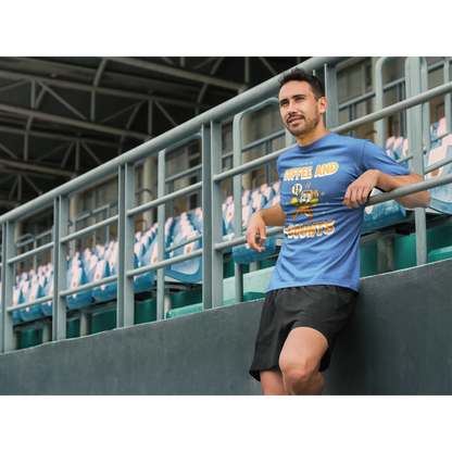 Male Cheerleading coach wearing a blue t-shirt with a cheerleading graphic design in a football stand