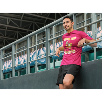 Male Cheerleading coach wearing a red t-shirt with a cheerleading graphic design in a football stand